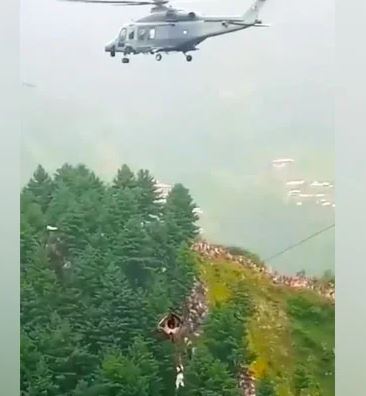 The image depicts one of the eight persons that were rescued from a hanging cable vehicle on August 22, 2023, in Battagram, Khyber Pakhtunkhwa.